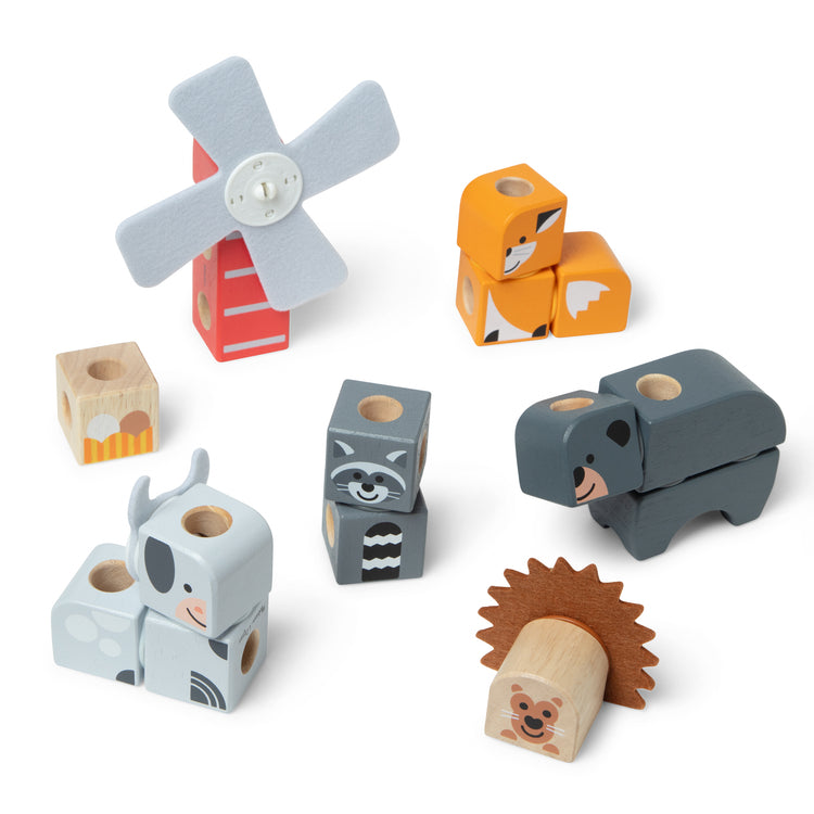 The loose pieces of The Melissa & Doug Blockables™ Farm and Woodland 2-Pack Bundle Connectable Wooden Building Blocks Preschool Play Set Toy 