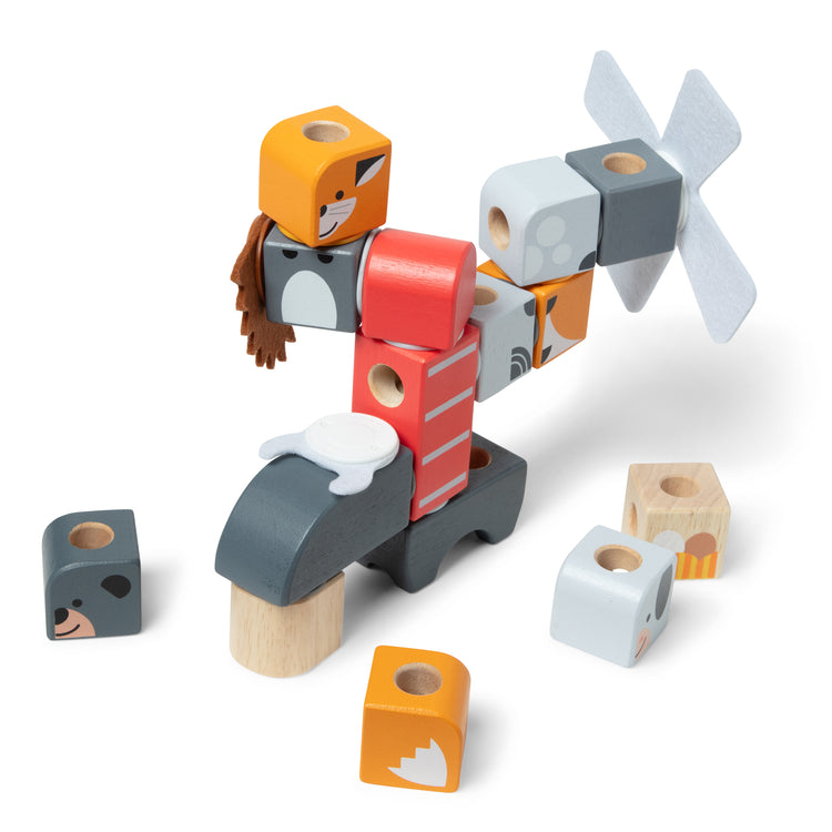 The loose pieces of The Melissa & Doug Blockables™ Farm and Woodland 2-Pack Bundle Connectable Wooden Building Blocks Preschool Play Set Toy 