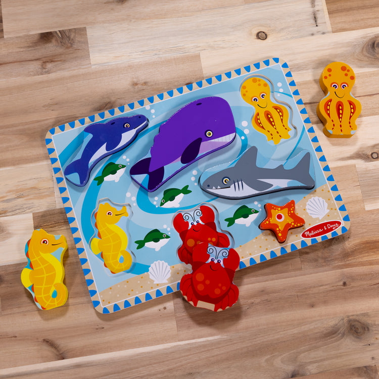 A playroom scene with The Melissa & Doug Sea Creatures Ocean Wooden Chunky Puzzle - 7 Pieces