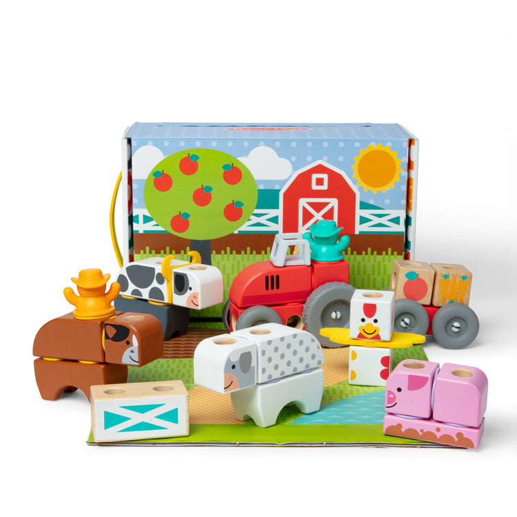 An assembled or decorated image of The Melissa & Doug Blockables™ Farm Snap And Play, Mix And Match Connectable Wooden Building Blocks Play Set Toy for Preschool Boys And Girls (56 Pcs)