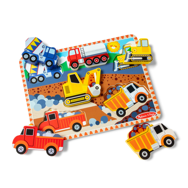 The loose pieces of The Melissa & Doug Construction Vehicles Wooden Chunky Puzzle (6 pcs)