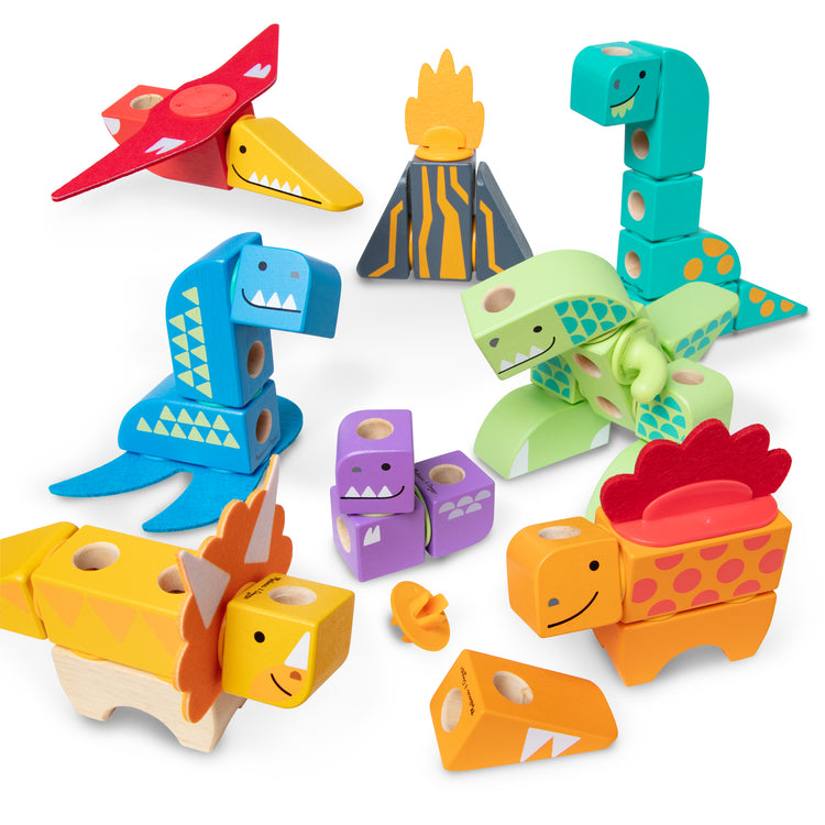 The loose pieces of The Melissa & Doug Blockables™ Dinosaur Snap And Play, Mix And Match Connectable Wooden Building Blocks Play Set Toy for Preschool Boys And Girls (69 Pcs)