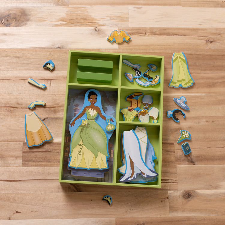 A playroom scene with The Melissa & Doug Disney Princess Tiana Magnetic Dress-Up Wooden Doll Pretend Play Set (30+ pcs)
