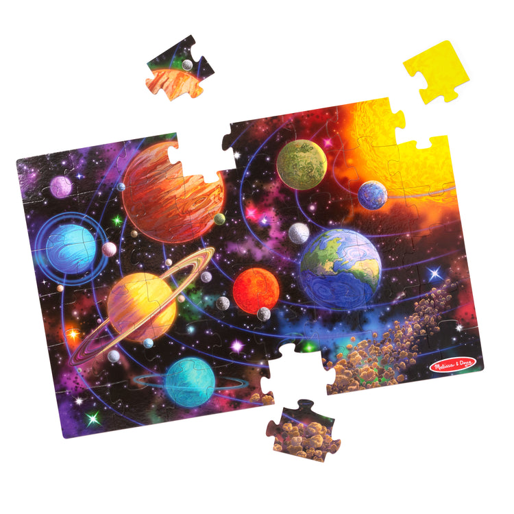 The loose pieces of The Melissa & Doug Solar System Jumbo Floor Puzzle, 48-Piece Space-Themed Jigsaw Puzzle With Planet Guide, 3 x 2 Foot Kids Puzzles for Toddlers Ages 3+ (No Text on Puzzle)