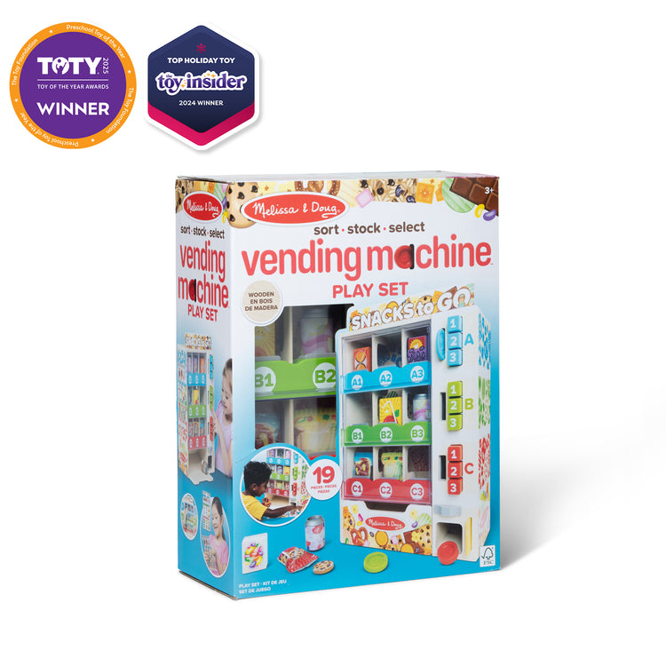 The front of the box for The Melissa & Doug Sort, Stock, Select Wooden Vending Machine Play Set, Wooden Toy Play Food For Boys and For Girls 3+