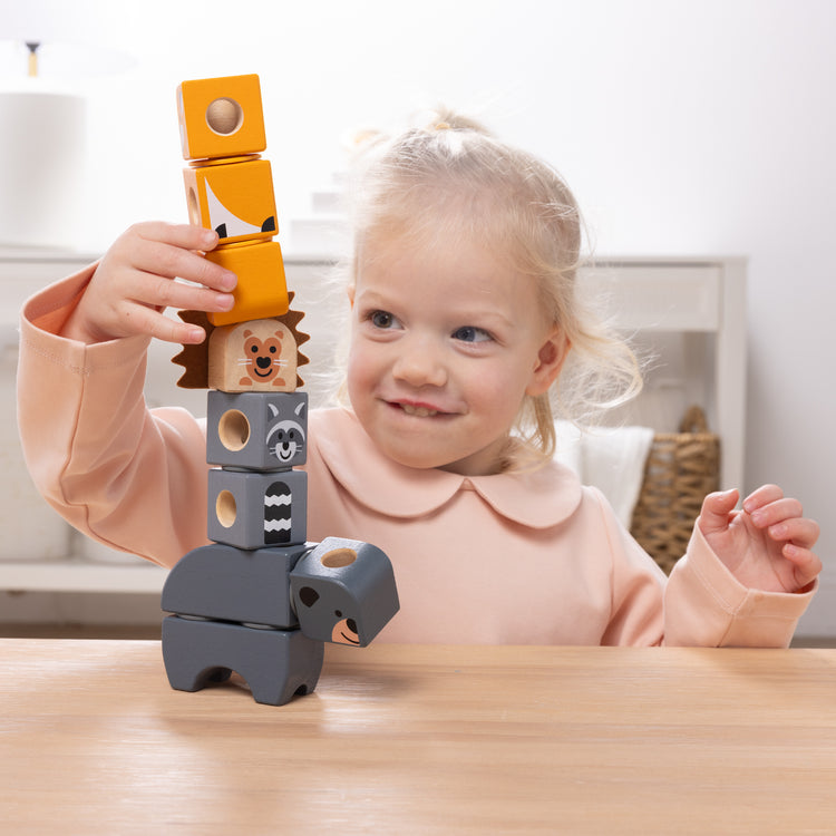 The front of the box for The Melissa & Doug Blockables™ Woodland Friends Snap And Play, Mix And Match Connectable Wooden Building Blocks Play Set Toy for Preschool Boys And Girls (16 Pcs)