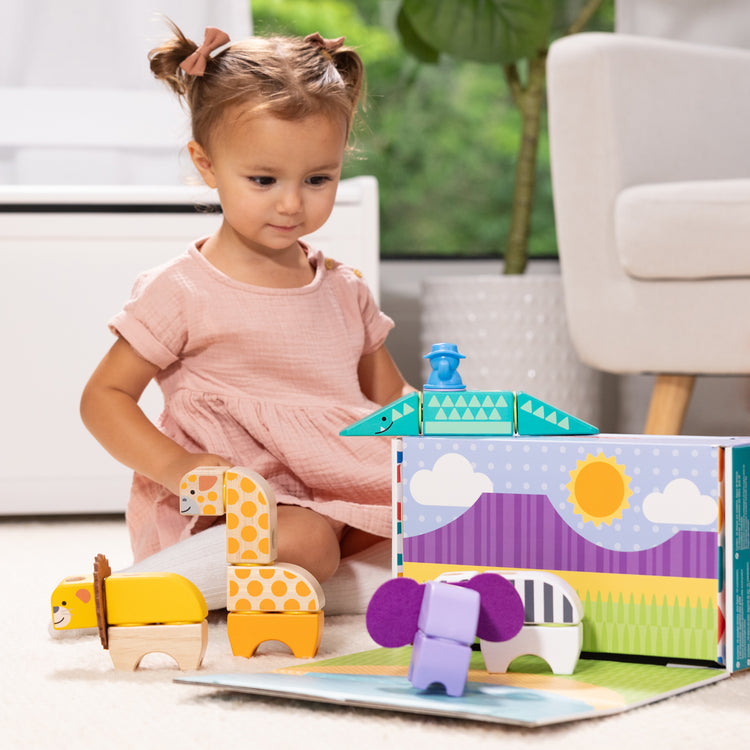 The front of the box for The Melissa & Doug Blockables™ Safari Snap And Play, Mix And Match Connectable Wooden Building Blocks Play Set Toy for Preschool Boys And Girls (34 Pcs)