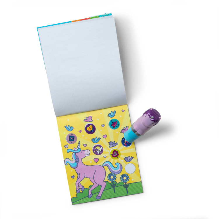 The loose pieces of The Melissa & Doug Sticker WOW!™ 24-Page Activity Pad and Sticker Stamper, 300 Stickers, Arts and Crafts Fidget Toy Collectible Character – Sprinkles the Purple Unicorn